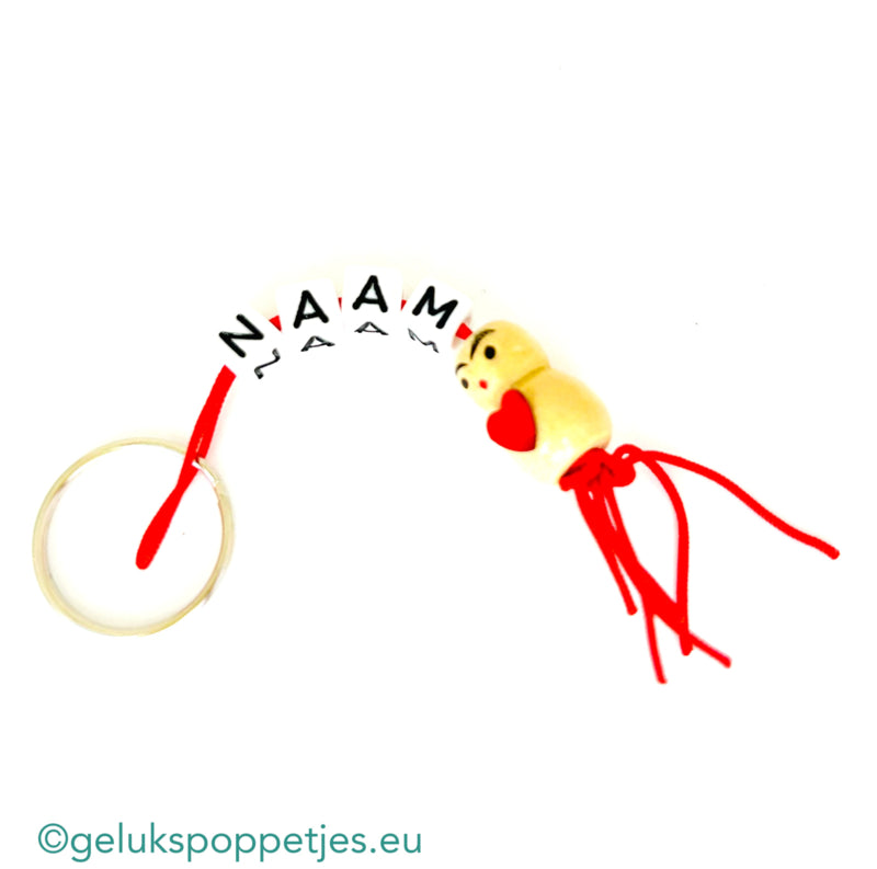 Name keychain with lucky charm heart on the belly