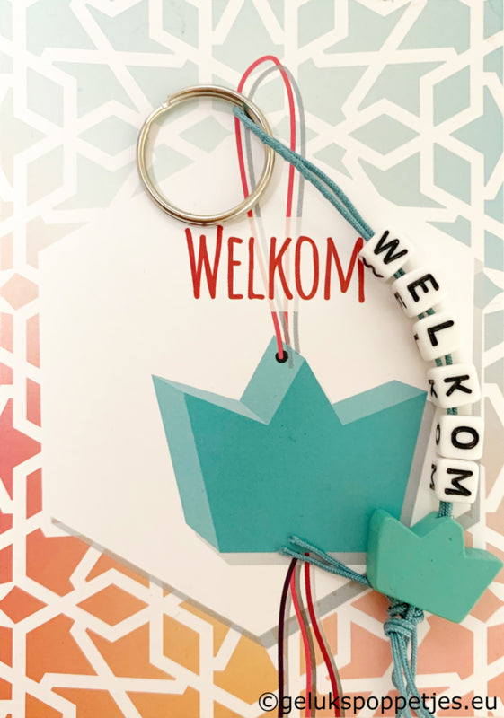 Welcome keychain with lucky charm crown