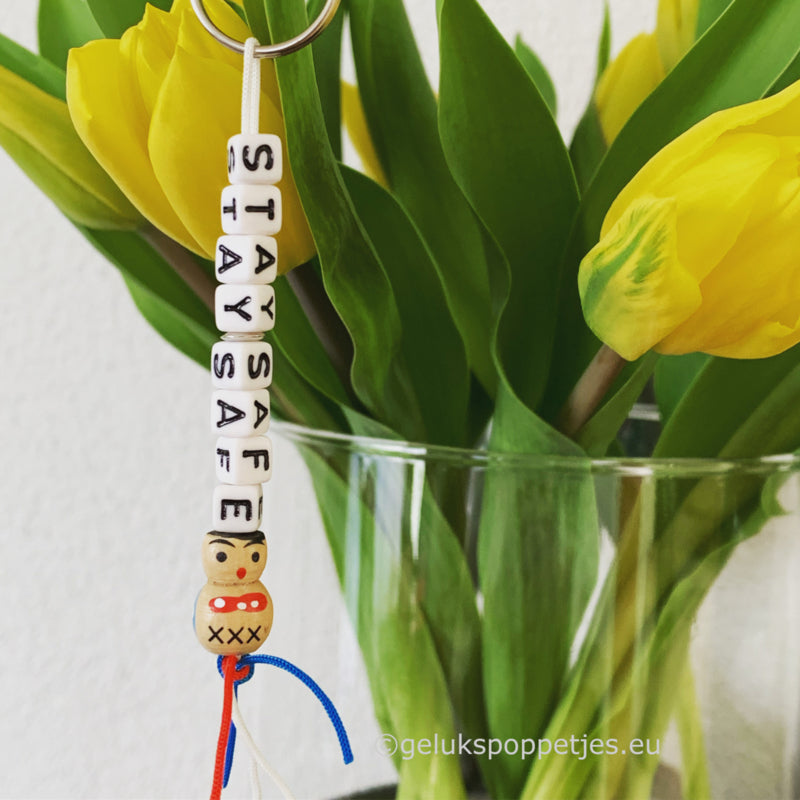 Stay safe keychain with wooden lucky charm