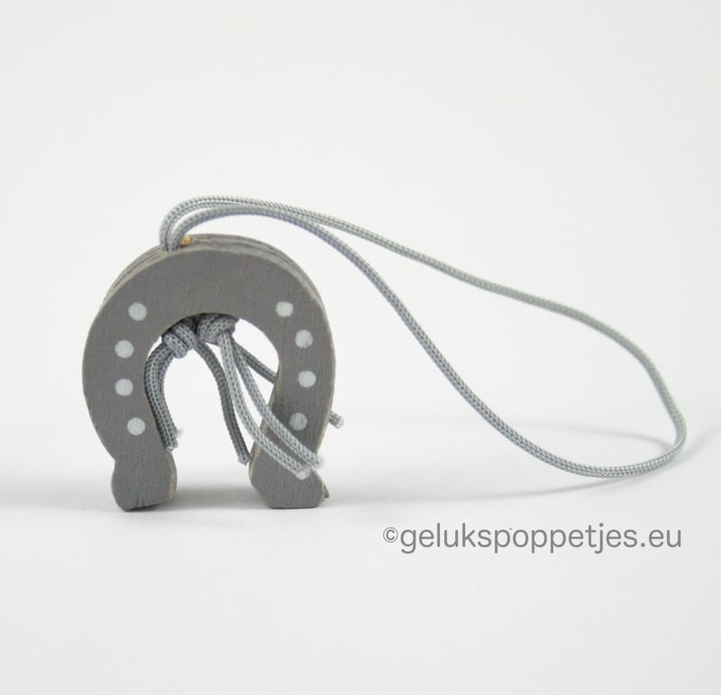 Horseshoe lucky doll