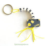 Keychain byebye with lucky charm suitcase
