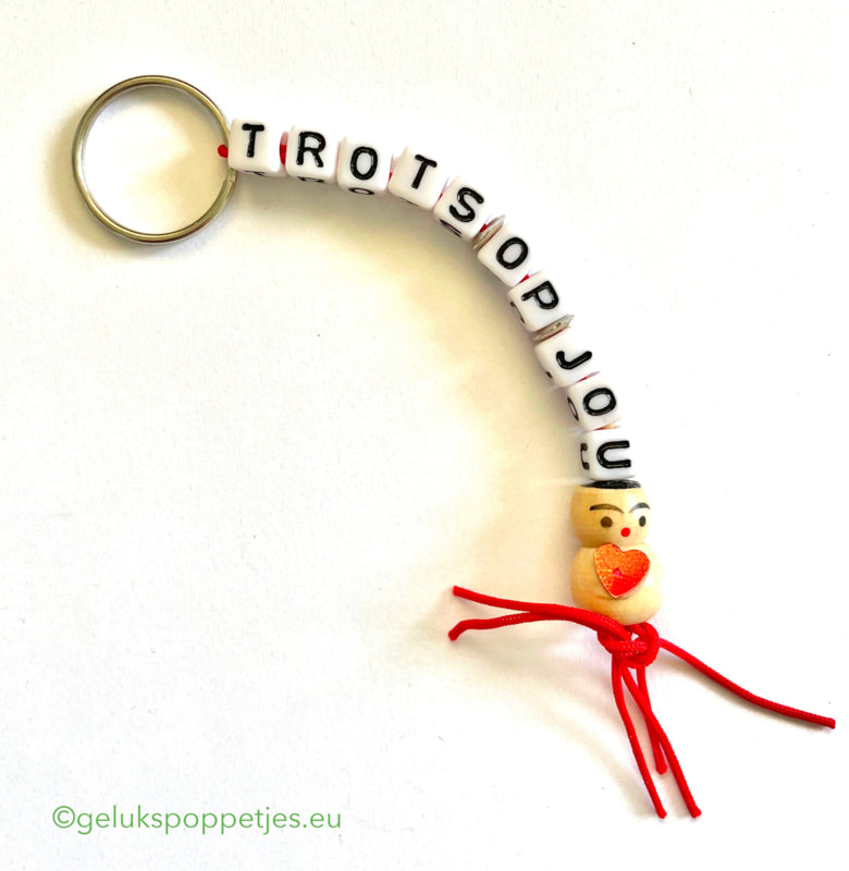 Proud of you keychain with lucky charm heart on the belly