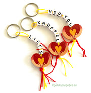 Keychain cuddly toy with lucky doll hug