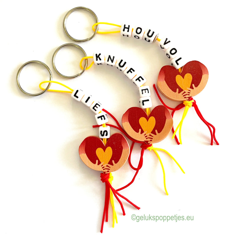 Keychain cuddly toy with lucky doll hug