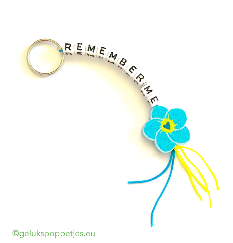 Keychain remember me with lucky doll forget me not