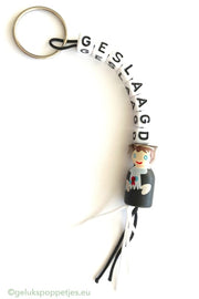 Graduated keychain with lucky professor doll