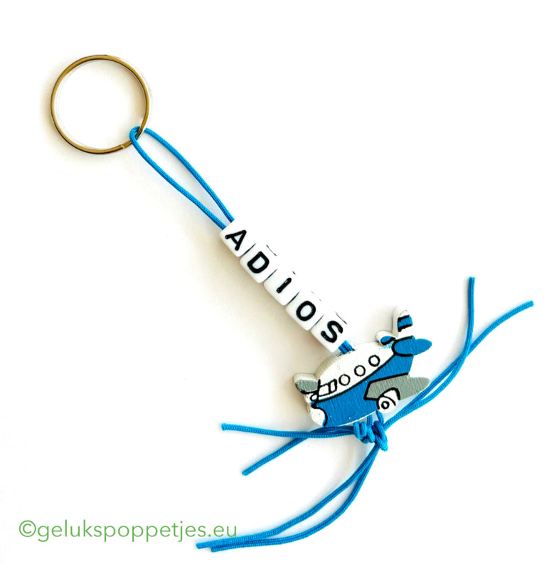 Keychain Adios with lucky doll airplane