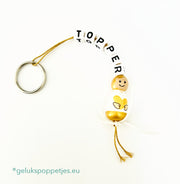 Key ring topper with lucky golden angel doll