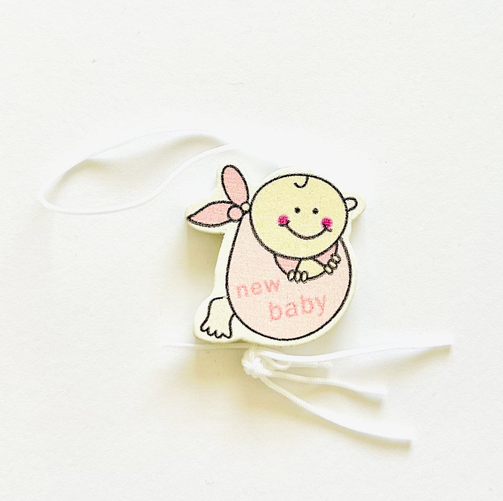 Lucky charm baby girl in cloth