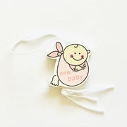 Lucky charm baby girl in cloth