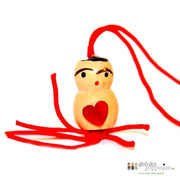 Lucky doll with heart on the belly