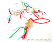 Gold-plated lucky doll