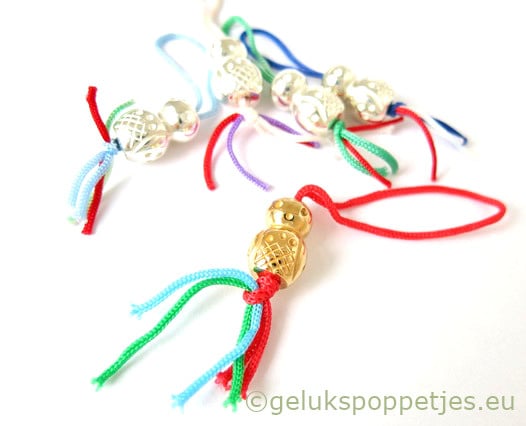 Gold-plated lucky doll