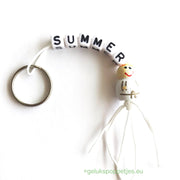 Summer keychain with lucky angel figure without wings