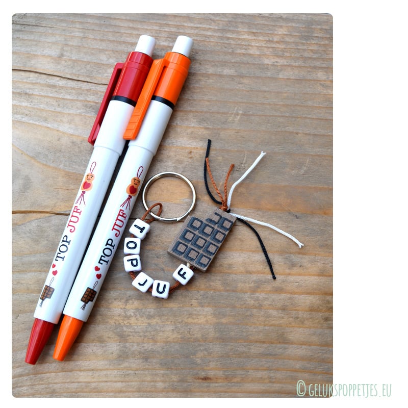 Keyring top teacher with lucky doll heart on the belly