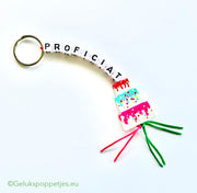 Congratulations keychain with lucky cake doll