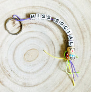 Keychain Miss Social with regular good luck charm