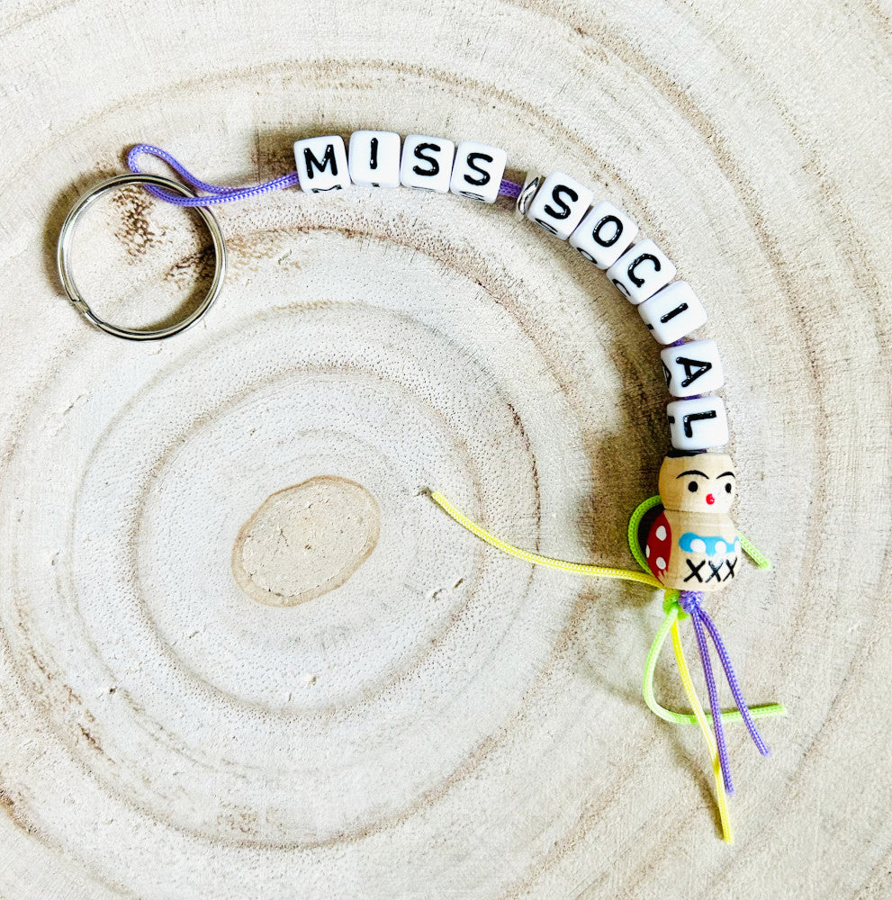 Keychain Miss Social with regular good luck charm