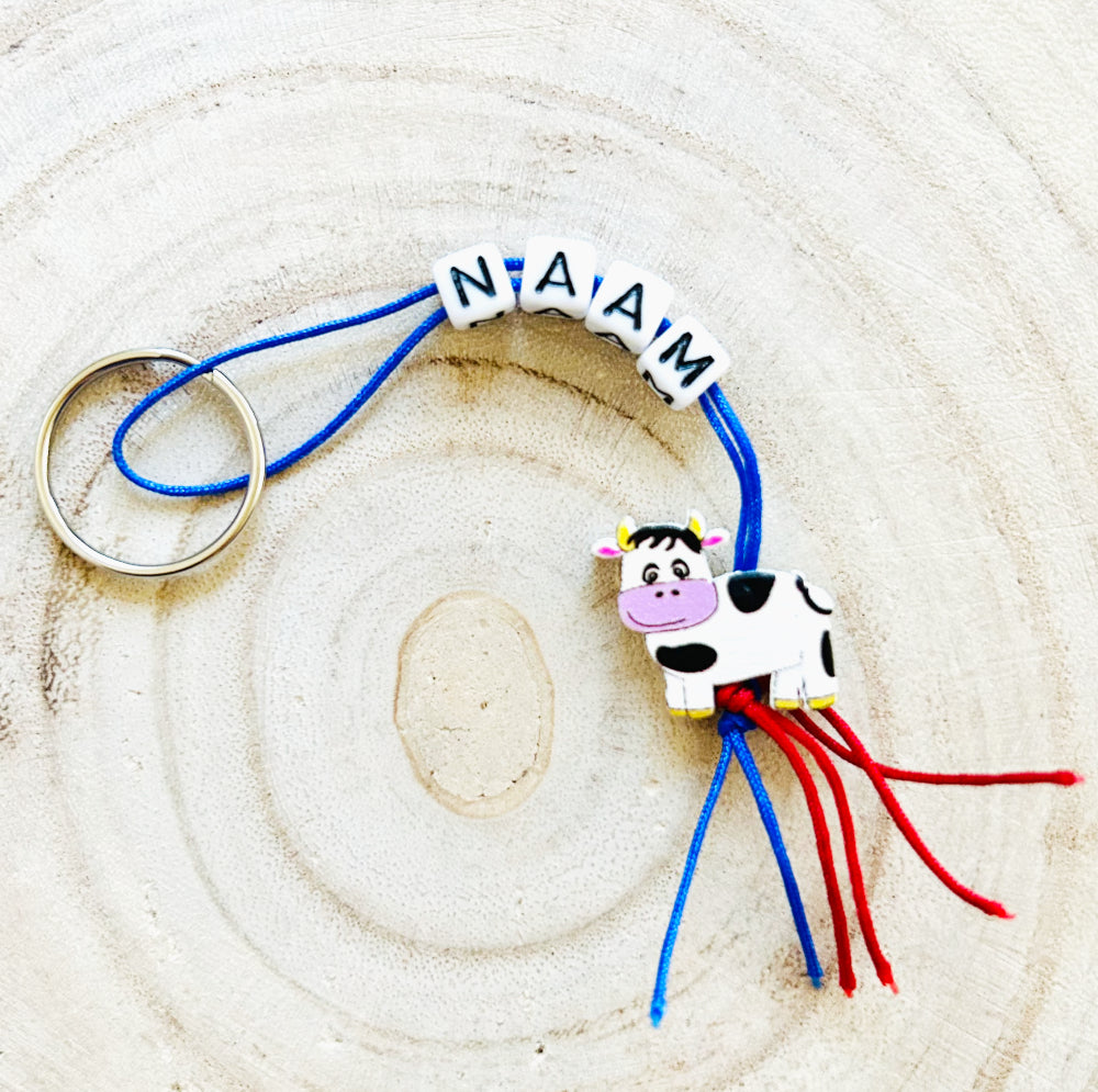 Personalized keychain with cow lucky charm