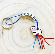 Personalized keychain with cow lucky charm