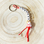 Keychain THANXXX with the heartthrob lucky doll